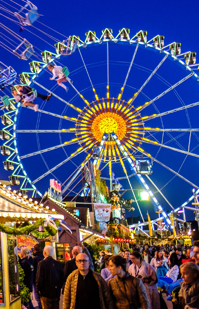 Colorful carnival with Ferris wheel and food stands at Wvec West Valley Events Complex in Phoenix, Arizona.