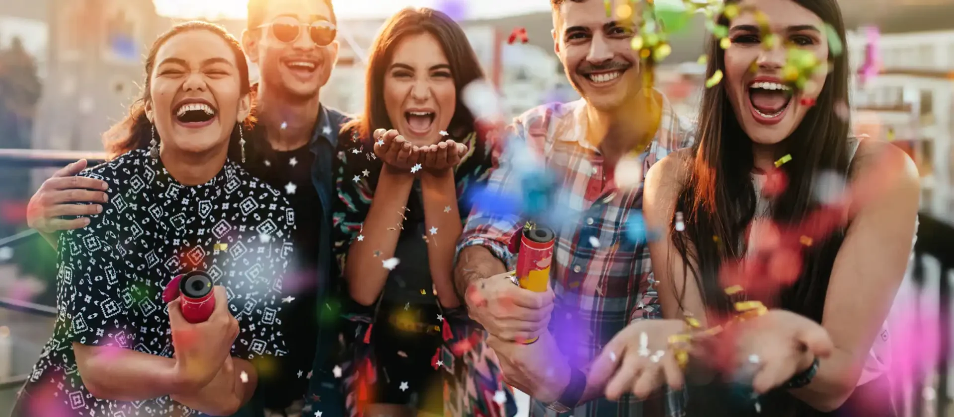 Group of friends celebrating with confetti at Wvec West Valley Events Complex in Phoenix, Arizona.
